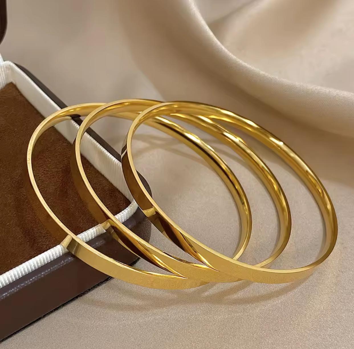 Trio of Glossy Golden Stainless Steel Bangles